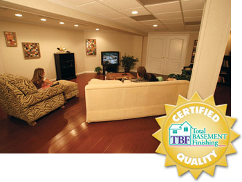 A remodeled basement with the Total Basement Finishing&trade; badge