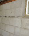 Severely buckling foundation walls in a home in Attleboro in need of repairs.