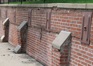 Rusted wall plate anchors in a retaining wall repair in Bridgewater.