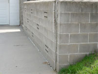 A retaining wall separating from the adjoining walls in Hyannis