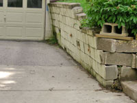 a failing retaining wall around a driveway in South Boston