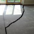 a huge crack in a concrete slab floor in Framingham