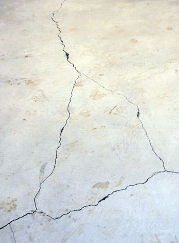 severely cracked, heaving slab floors in a home in Martha's Vineyard