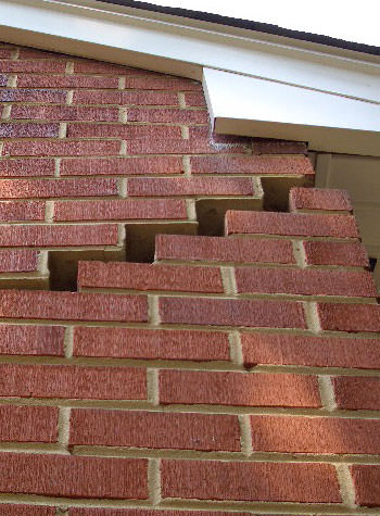 photo of a rotating foundation wall with cracks in New Bedford