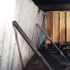 Temporary foundation wall supports stabilizing a Quincy home