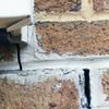 Failed crack repair showing old tuckpointing that cracked on a Framingham home.