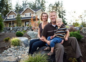 A happy family outside a home with a repaired foundation in Martha's Vineyard