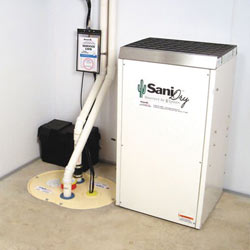 Sump pump system, dehumidifier, and basement wall panels installed during a sump pump installation in Milton