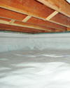 a moisture barrier installed on the walls and floors of a crawl space in Cape Cod