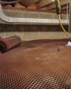 Crawl space drainage matting installed in a home in Brookline