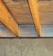 SilverGlo™ insulation installed in a floor joist in Braintree