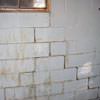 A cracked foundation wall near a window in a Attleboro home