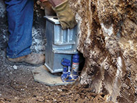 Securing a foundation footing bracket for a foundation repair system in Cumberland.