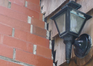 A tilting chimney in Weymouth showing serious foundation damage.