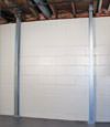 A steel i-beam system installed on a Worcester foundation wall