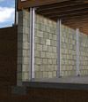I-beam foundation wall supports installed in a Hyannis basement.