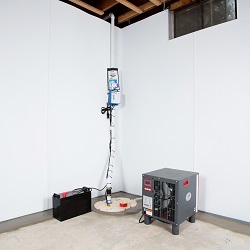 Sump pump system, dehumidifier, and basement wall panels installed during a sump pump installation in Milton