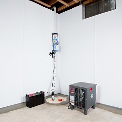 Sump pump system, dehumidifier, and basement wall panels installed during a sump pump installation in Woonsocket