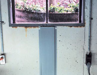 Repaired waterproofed basement window leak in Quincy