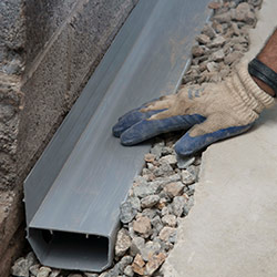 installing a drain tile system in a Milton home